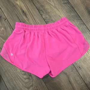 These are sonic pink Lululemon 2.5 hotty hot shorts.